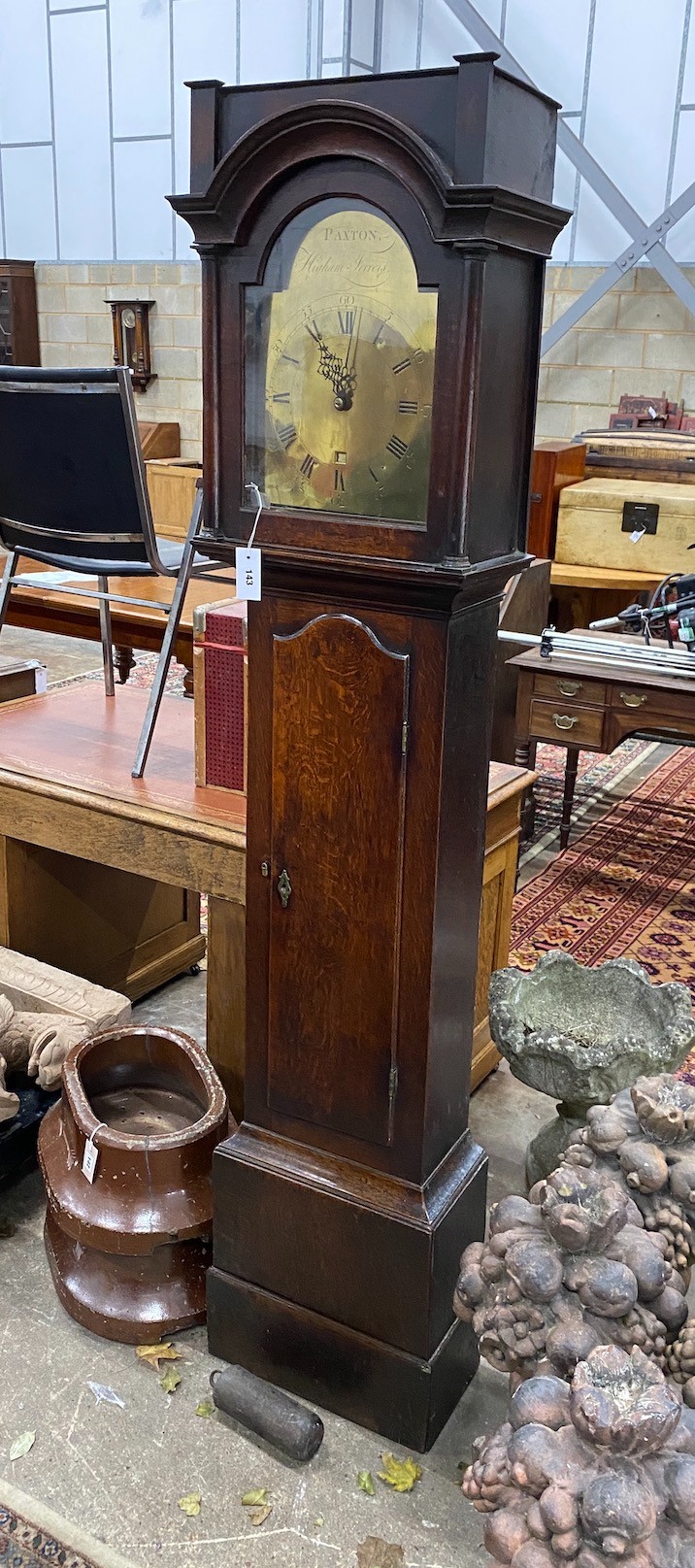 An early 19th century oak 30 hour longcase clock, the arched brass dial marked Paxton, Higham Ferrers, height 199cm